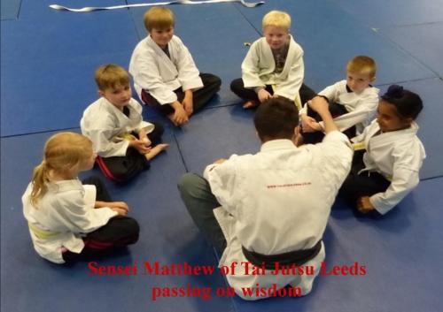 Juniors martial art instructor passing on wisdom