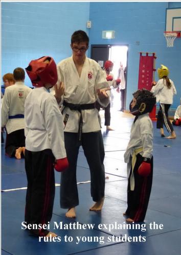 Juniors sensei matthew explaining the rules of boxing