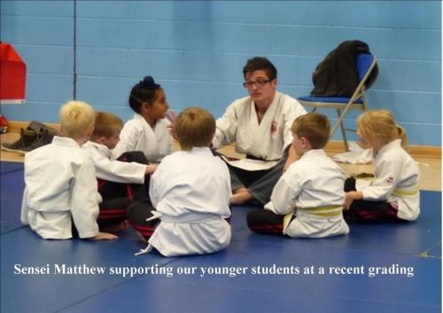 Juniors sensei surpporting junior martial art  students in leeds